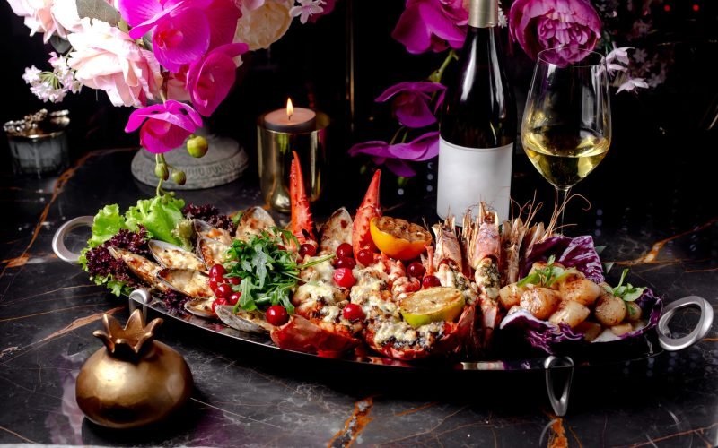 hot seafood platter with lobster oyster tiger prawns scallops